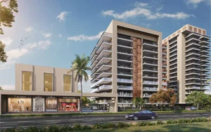 Modern luxury residential apartments with spacious balconies and a commercial shopping area in the foreground, located on a well-connected road with greenery and a clear blue sky.